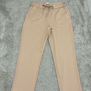Tan work pants with adjustable waist band. Tan color, soft and comfortable fit.